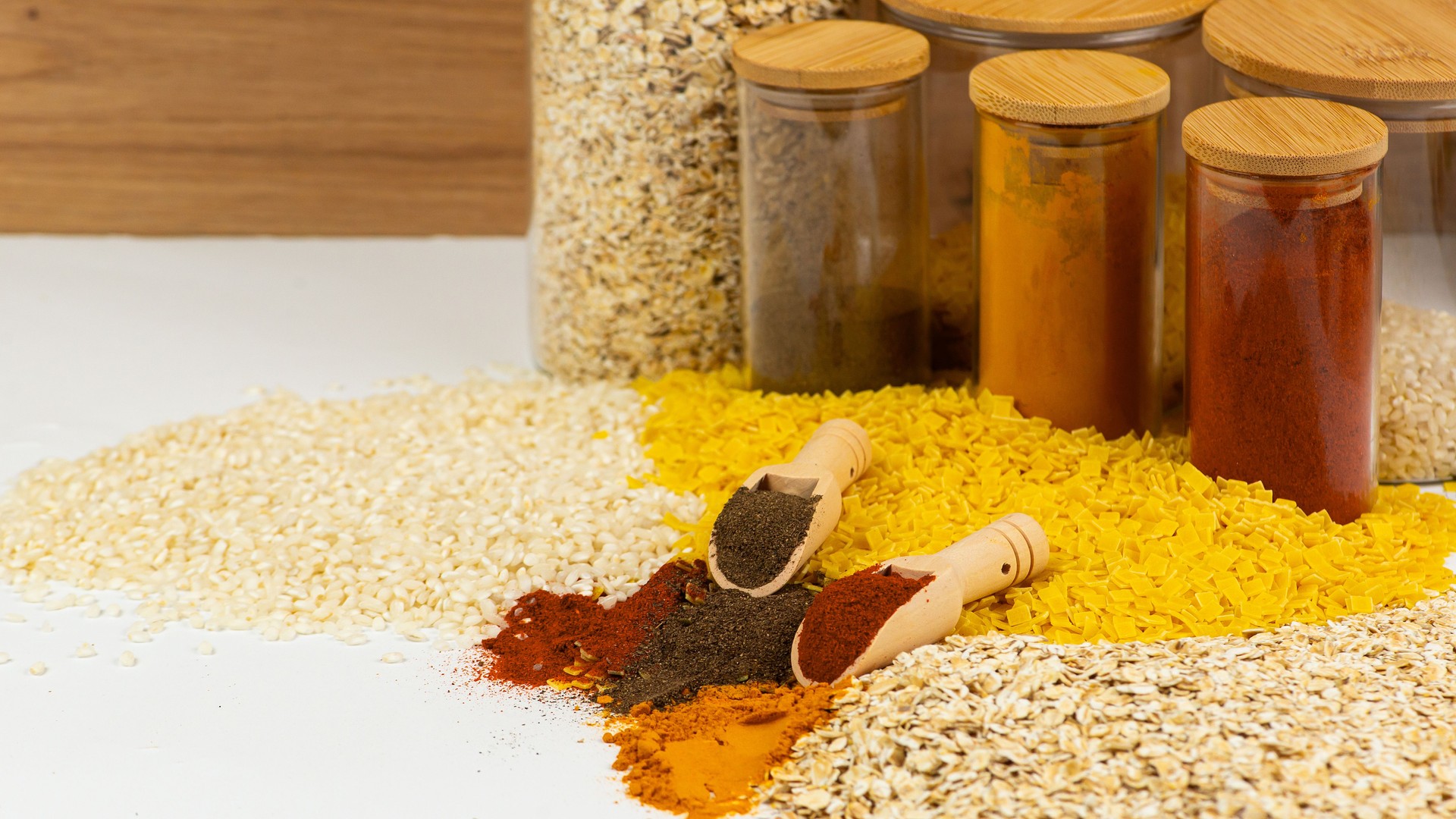 A Variety of Colorful Spices and Grains Neatly Displayed in Jars for Culinary Inspiration